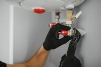 Subcontractor working on plumbing installation for Oak and Anchor Builders